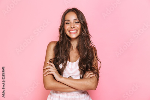 Fotomural Image of european lovely woman 20s with long hair wearing dress smiling at you w