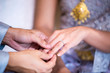 © kanpisut - Groom and brides hands with rings,Rings of husband and wife.Two hands on a wedding day.