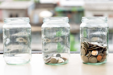 Saving Money Coin Accumulated In Glass Jar