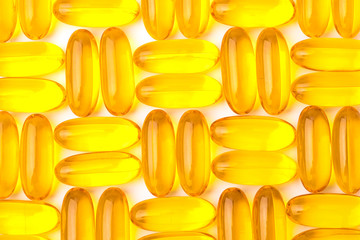 Omega 3 capsules from fish oil on a white background with copy space. Texture