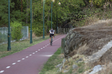 Man cycling on pedestrian cycle path, in Viseu, Portugal