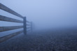 Dense fog and wooden fence