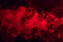 Colorful Smoke On A Black Background Of Red And White Colors. The Concept Of Smoking. Beautiful Textural Background