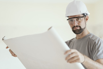 Wall Mural - Construction engineer checking a house plan