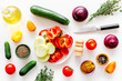 © 9dreamstudio - Healthy food concept. Ingredients for vegetable stew. Squash, bell pepper, tomato, spices, oil on white background top view