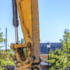 Canvas Print - Filthy yellow arm of a construction vehicle