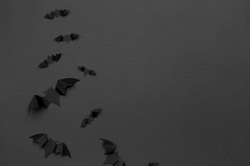 Wall Mural - halloween and decoration concept - paper bats flying