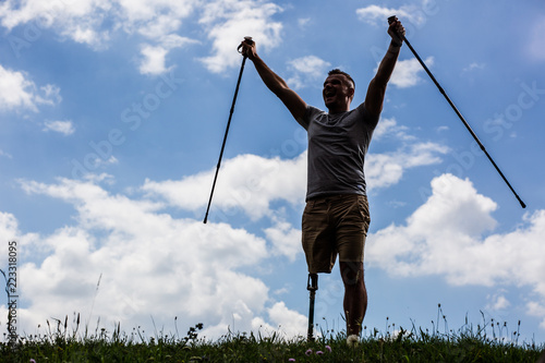 Foto Open minded young man with disability enjoying his life