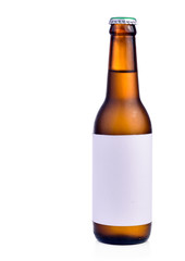 Bottle of beer with drops isolated on white background