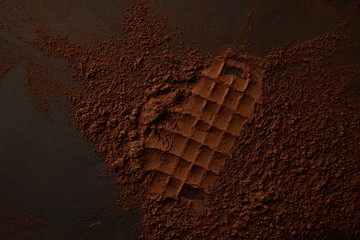 Wall Mural - top view of gourmet cocoa powder on black background