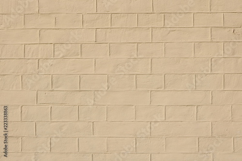 Fotografía faded natural yellow clay background with brick texture