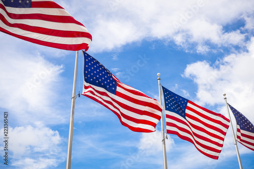 Row of US stars and stripes flags fluttering in the wind - Stock Image ...