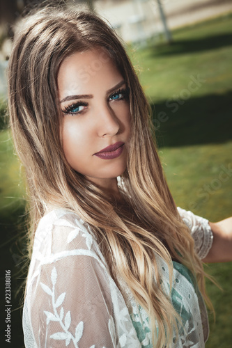 Portrait Of A Young And Beautiful Blonde Woman Blue Eyes Long