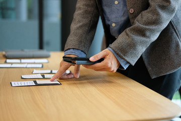 user experience UX designer designing web on smartphone layout. UI planning mobile application. developer work with business prototype