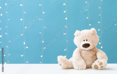 A teddy bear on a shiny lig...