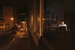 © mavoimages - Asian businessman working late at night in his downtown office
