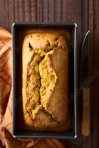 Plakat Fresh homemade pumpkin bread in pan, photographed overhead (Selective Focus, Focus on the top of the bread)