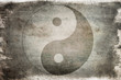 Chinese yin yang sign on a background on old, painted wood