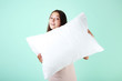 © 5second - Young girl with white pillow on mint background