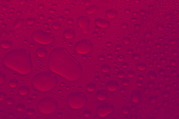 Canvas Print - water drops on crimson red background texture