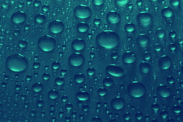 Wall Mural - water drops on blue background texture