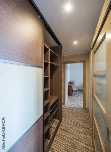 Interior Of The Flat Warm Tones Wooden Floor Built In Wardrobe