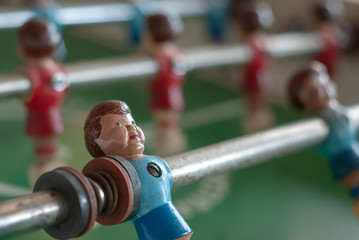 Blue model player on a foosball game