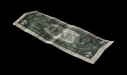 One dollar bill isolated on black background