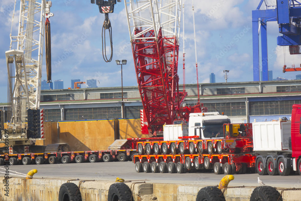 Industrial port crane lift up loading export containers box onboard ...