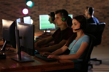 Poster - Young people playing video games at tournament