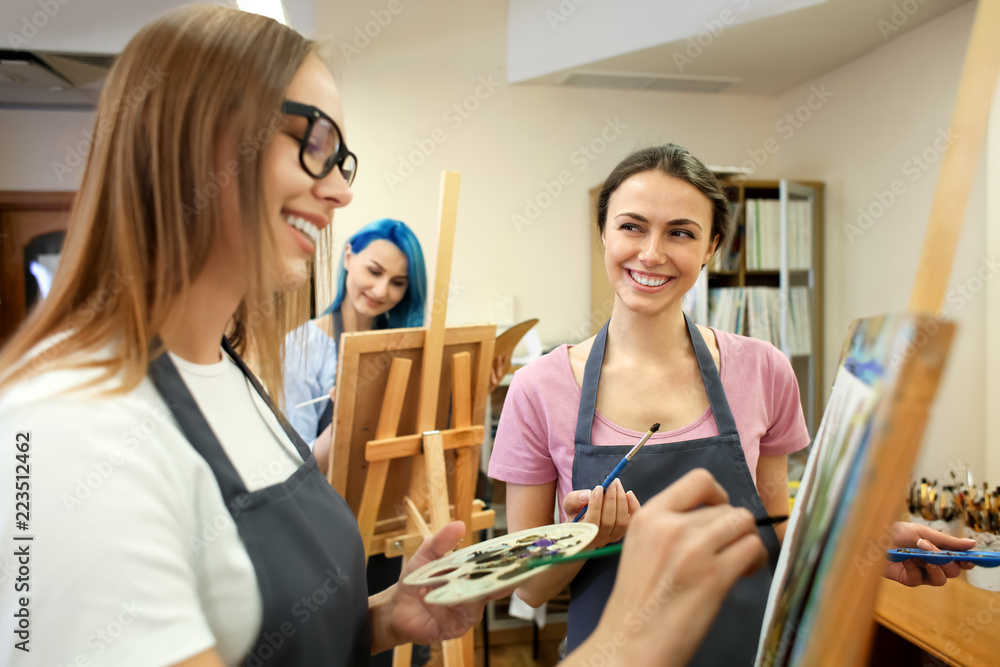 Art students painting in workshop