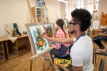 Wall Mural - Art students painting in workshop