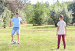 © Pixel-Shot - Little boy with his dad playing football outdoors