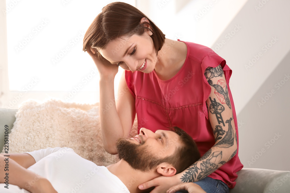 Happy lovely couple resting at home