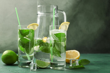 Composition with fresh mojito on green table