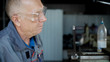 © kustvideo - Man looking at metal detail in workshop