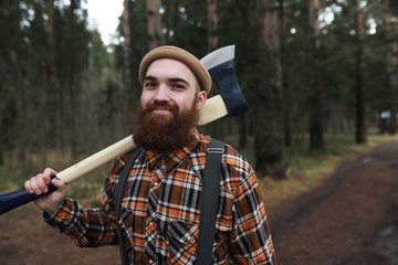 Wall Mural - A bearded lumberjack with a large ax 