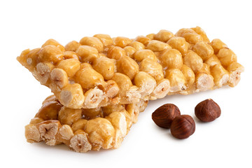 Two hazelnut snack bars isolated on white. Three shelled hazelnuts.