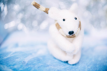 Wall Mural - Holidays, winter and celebration concept - Christmas and new year card with toy polar bear. Blurred background.