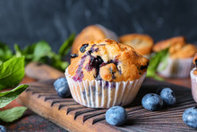 Tasty Blueberry Muffin On Wooden Board