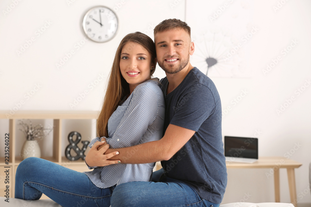 Happy loving couple resting at home