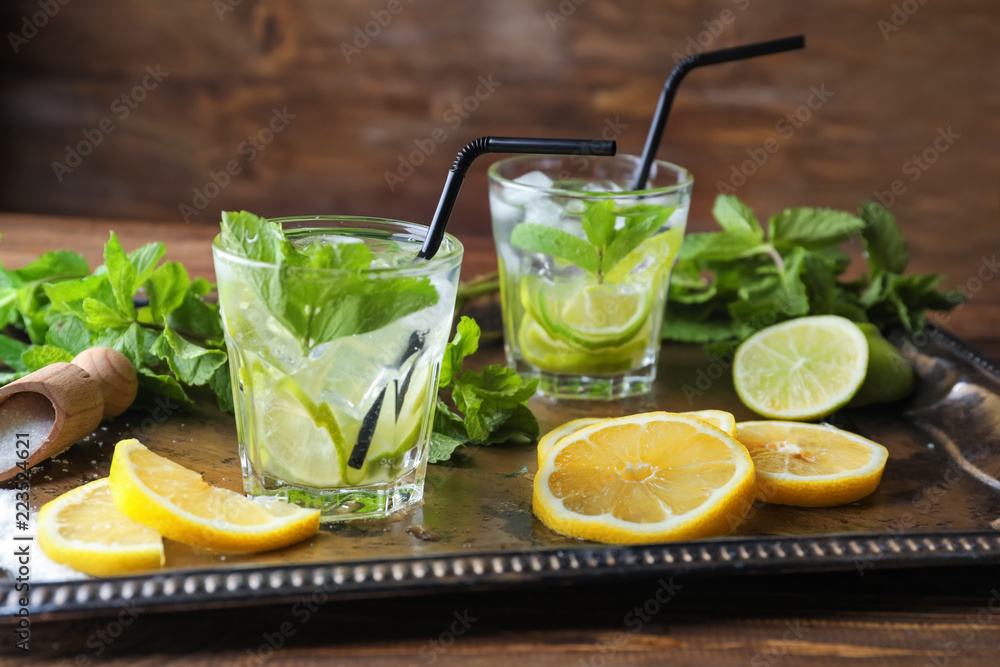Glasses of fresh mojito on metal tray