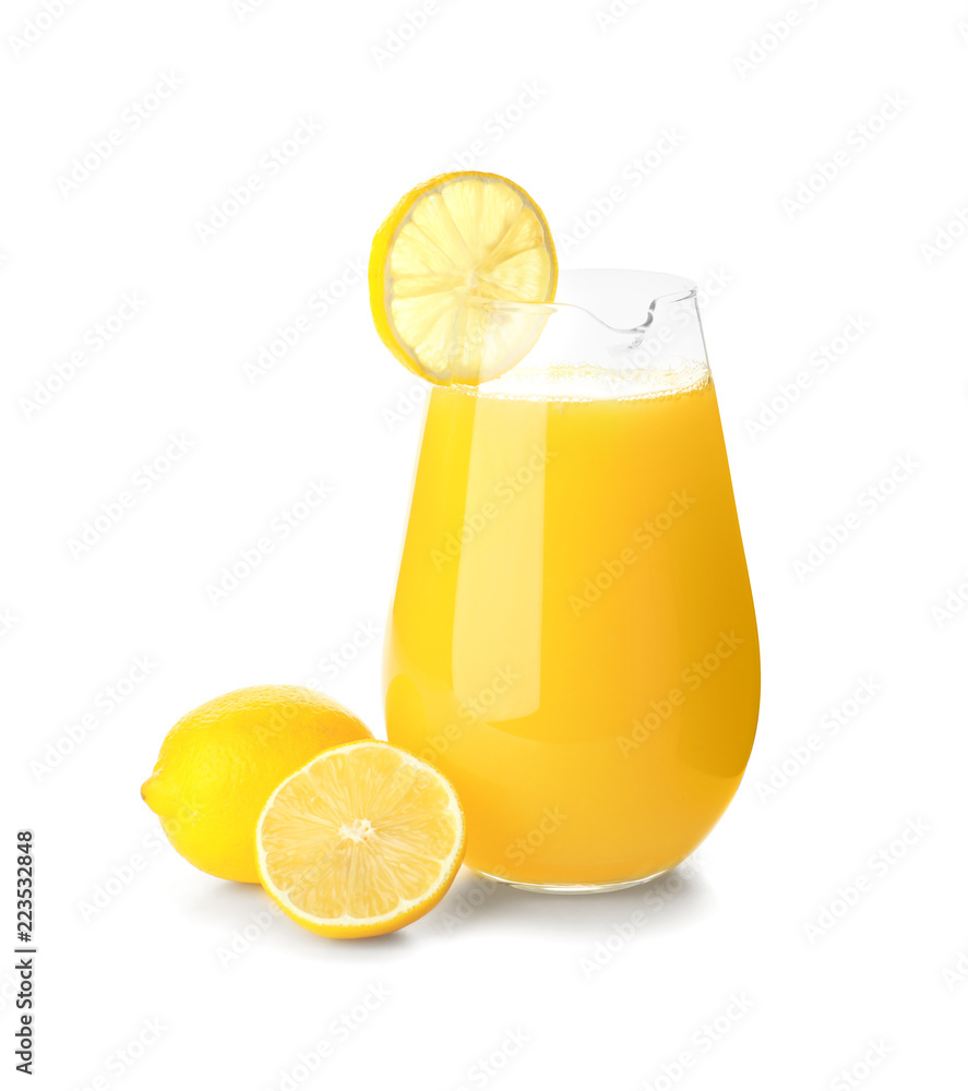 Jug of fresh lemon juice on white background