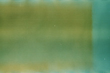 Green And Yellow Background Of The Developed Film. Edge Of The Film