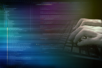 Wall Mural - software source coding. programmer is typing on keyboard with overlay text as background. concept fo