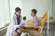 © LStockStudio - A Woman Physician Talking With Her Patient