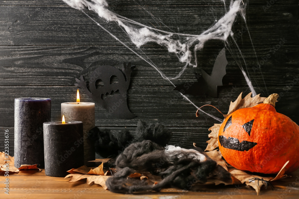 Creative decorations for Halloween party near dark wooden wall