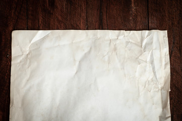 Background texture of crumpled aged paper with spot and stain