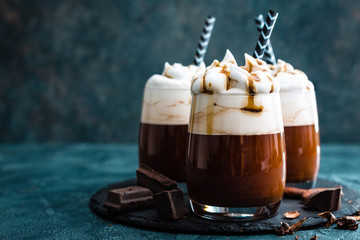 Wall Mural - Hot chocolate with whipped cream. Chocolate dessert drink in glass