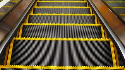 Canvas Print - View of working escalator while moving down